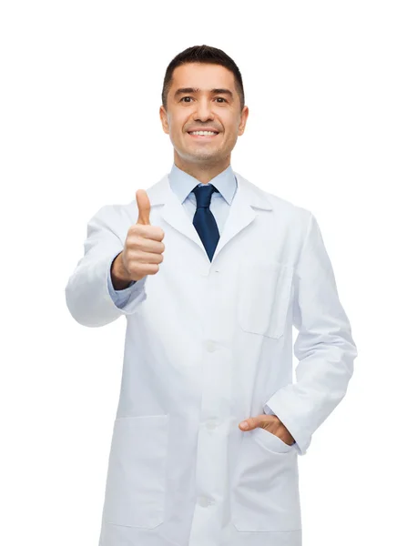 Smiling doctor in white coat showing thumbs up — Stok fotoğraf