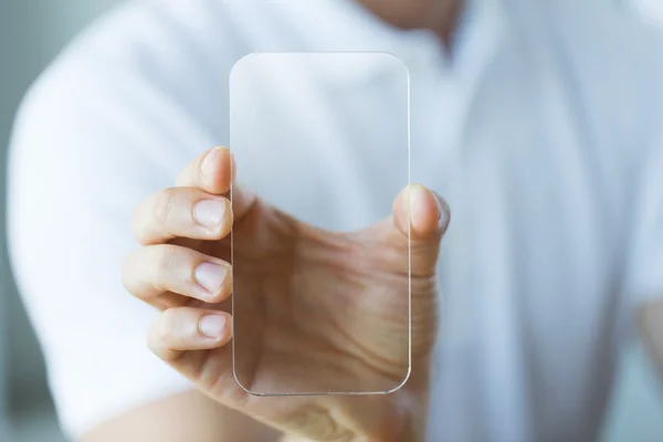 close up of male hand with transparent smartphone