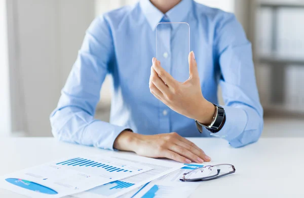 Close up of woman with transparent smartphone — Stock Photo, Image