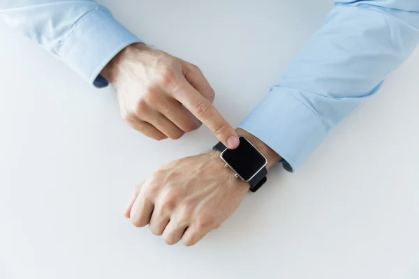 Close up of male hands setting smart watch — Stock Photo, Image