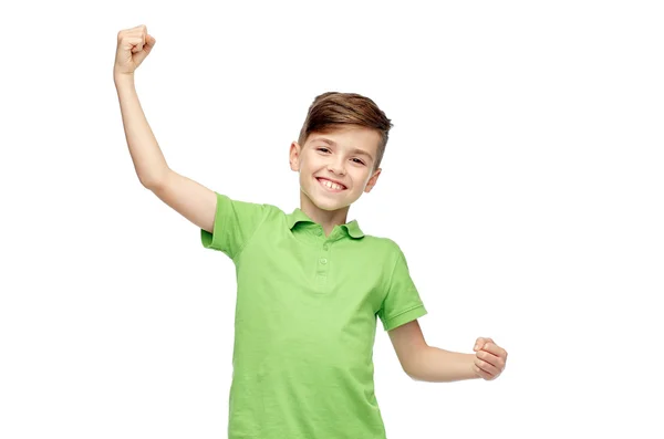 Happy boy in polo t-shirt showing strong fists — Stok fotoğraf