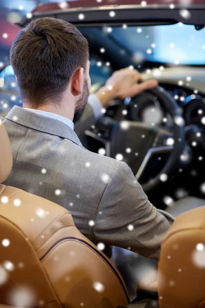 Close up of man in cabrio car at auto show — Stock Photo, Image