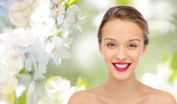 Smiling young woman face and shoulders — Stock Photo, Image