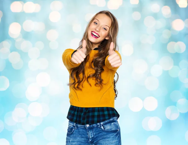 Feliz joven mujer o adolescente chica mostrando pulgares hacia arriba — Foto de Stock