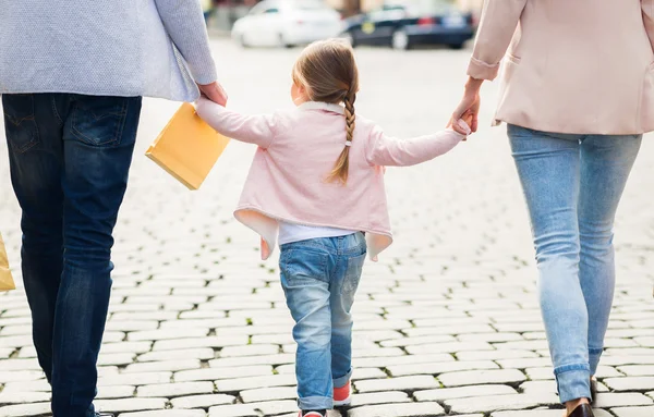 Close up of family with child shopping in city — Stock Photo, Image