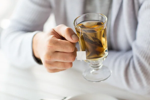 Close up of man drinking tea at home or cafe — Stock Photo, Image