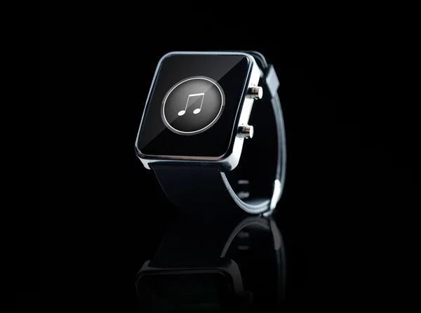 Close up of black smart watch with music note icon — 图库照片