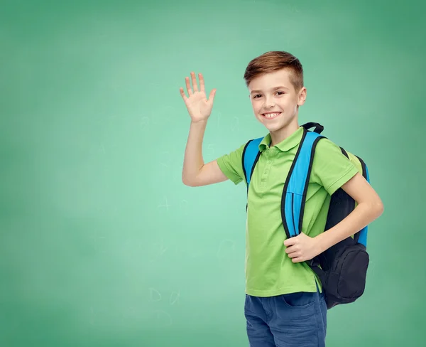 Happy student boy with school bag waving hand — Φωτογραφία Αρχείου