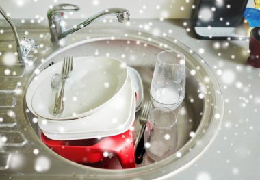 close up of dirty dishes washing in kitchen sink clipart