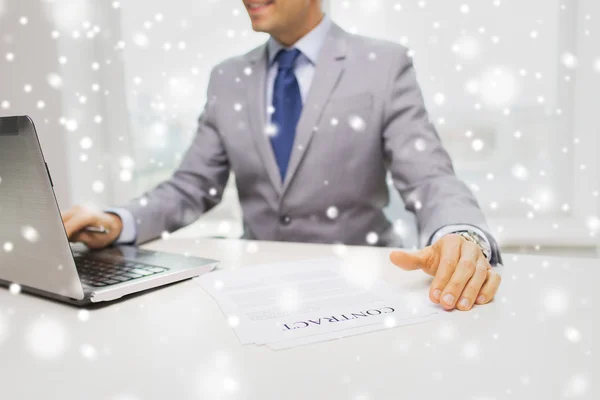 Close up of businessman with laptop and papers — Stock Photo, Image