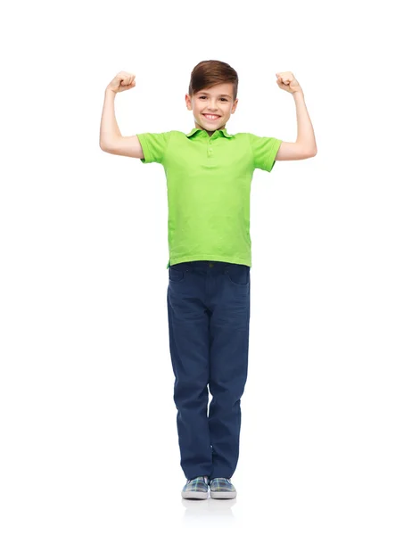 Happy boy in polo t-shirt showing strong fists — Zdjęcie stockowe