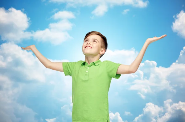 Lycklig pojke i polo t-shirt höjande händer upp — Stockfoto