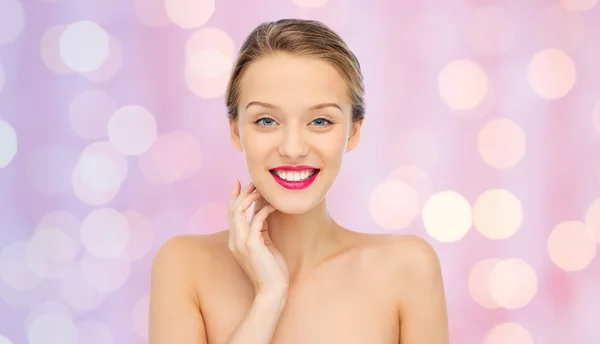 Smiling young woman with pink lipstick on lips — Stock Photo, Image