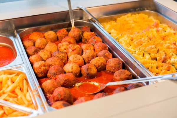 Close up of meatballs and other dishes on tray — Stock Photo, Image