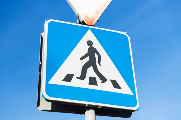 close up of pedestrian crosswalk road sign