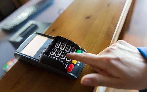 Hand entering password to bank terminal — Stock Photo, Image