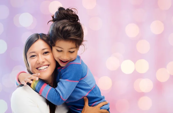 Happy mother and daughter hugging — Stock Photo, Image