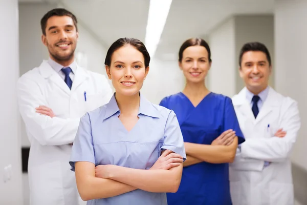 Happy group of medics or doctors at hospital — Stock Photo, Image