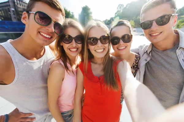 Smiling friends taking selfie Stock Image