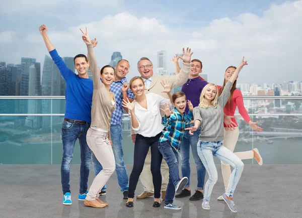 Happy people having fun over city waterside — Stock Photo, Image