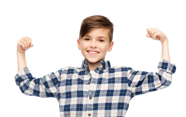 Gelukkige jongen in geruite shirt toont sterke vuisten — Stockfoto