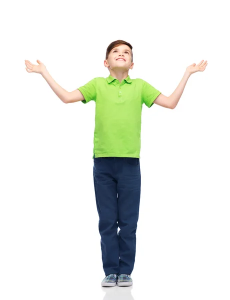Lycklig pojke i polo t-shirt höjande händer upp — Stockfoto