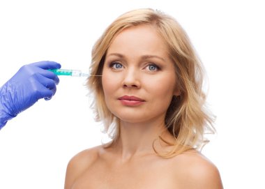 woman face and beautician hand with syringe clipart