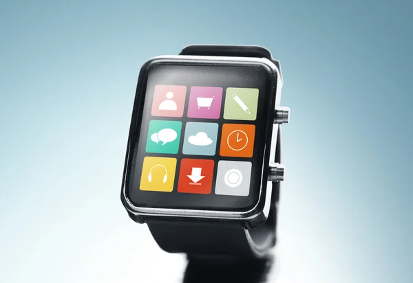 Close up of black smart watch with app icons — Stock Photo, Image