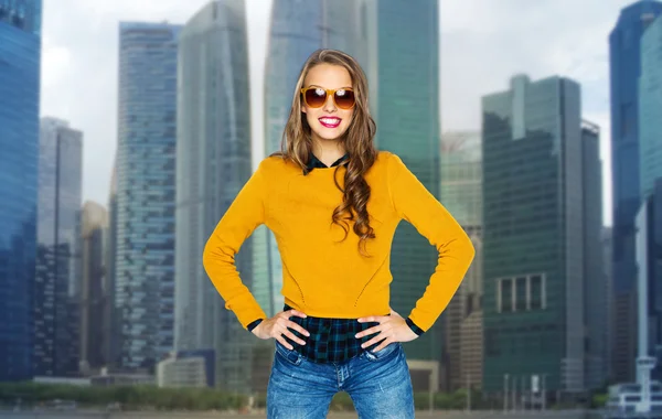 Happy young woman or teen girl in shades over city — 图库照片
