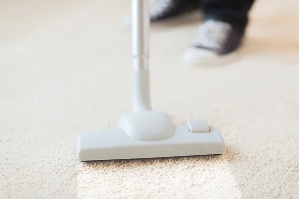 Close up of male hoovering carpet — Stock Photo, Image