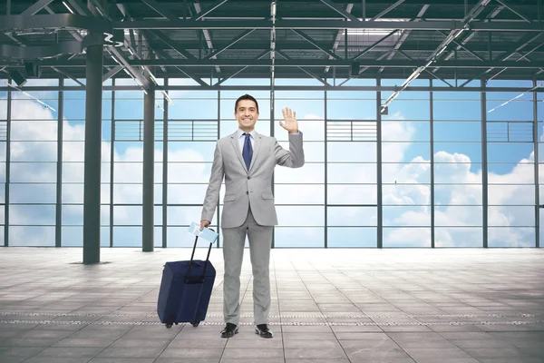 Businessman with travel bag and ticket at airport Stock Snímky