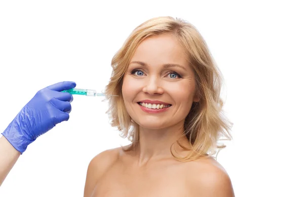 Happy woman face and beautician hand with syringe — Stock Photo, Image