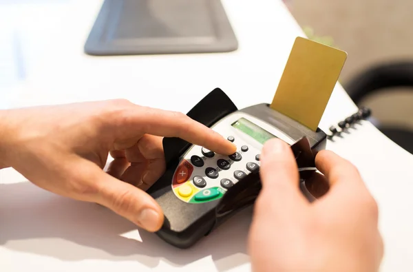 Hand entering pin code to bank terminal — Stock Photo, Image