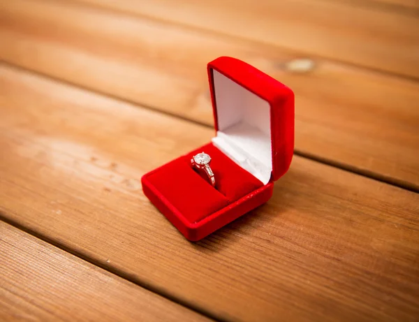 Close up of gift box with diamond engagement ring — Stock Photo, Image
