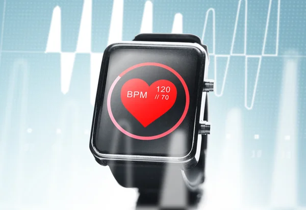 Close up of black smart watch with heart beat icon — Stock Photo, Image