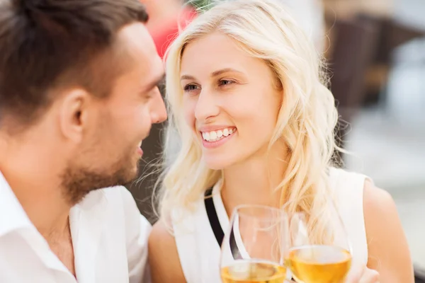 Happy couple clinking glasses at restaurant lounge Royalty Free Stock Images