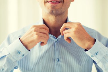close up of smiling man in shirt dressing clipart