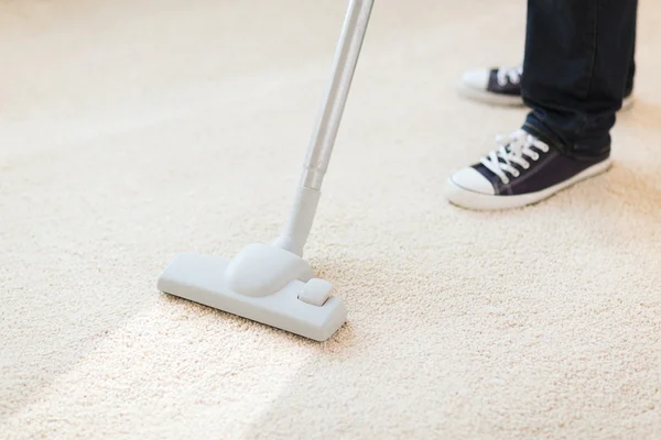 Close up of male hoovering carpet — Stock Photo, Image