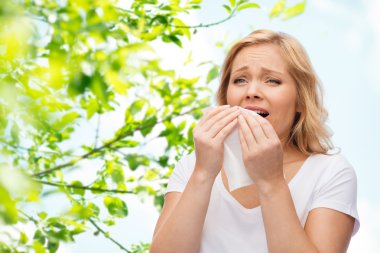 unhappy woman with paper napkin sneezing clipart