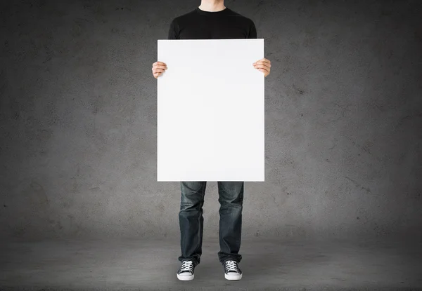 Close up of man holding big blank white board — Stockfoto