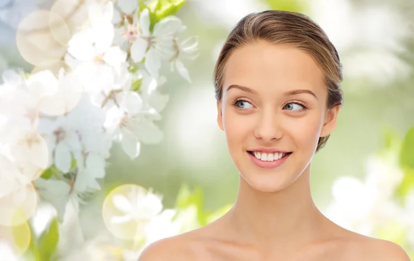 Smiling young woman face and shoulders — Stock Photo, Image