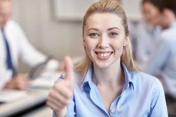 Group of smiling businesspeople meeting in office — Stock Photo, Image