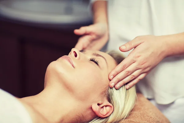 Close up of woman having face massage in spa — Stock Photo, Image