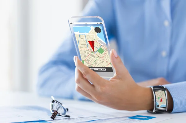 Hand with navigator map on smart phone and watch — Φωτογραφία Αρχείου