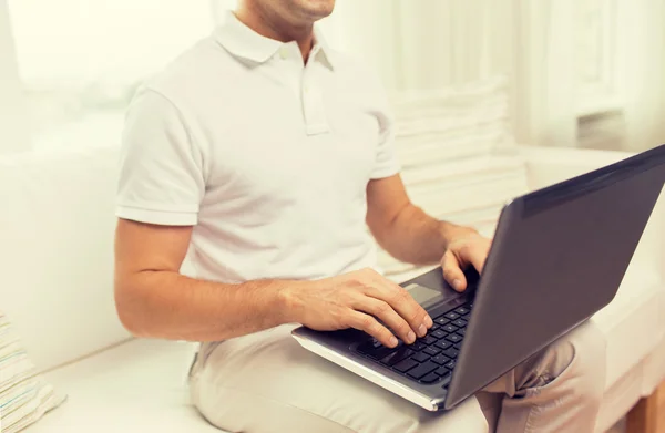 Close up of man working with laptop at home — Stock Photo, Image