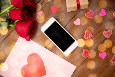 close up of smartphone, gift, red roses and hearts clipart