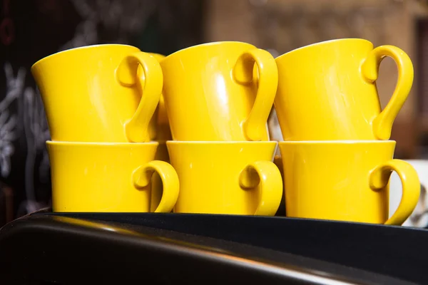 Close up of cups heating on coffee machine — Stok fotoğraf