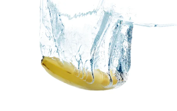 Banana falling or dipping in water with splash — Zdjęcie stockowe