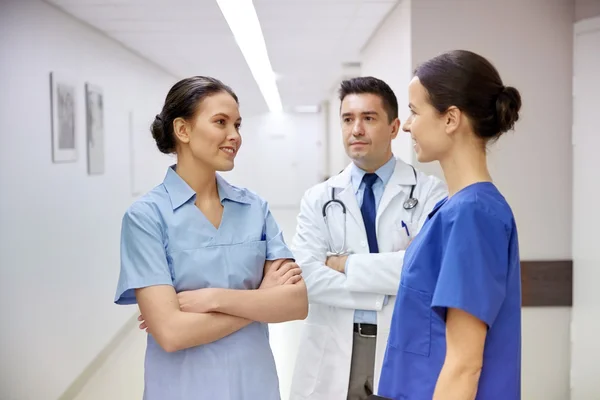 Group of medics or doctors talking at hospital Stock Photo