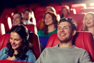 happy friends watching movie in theater clipart